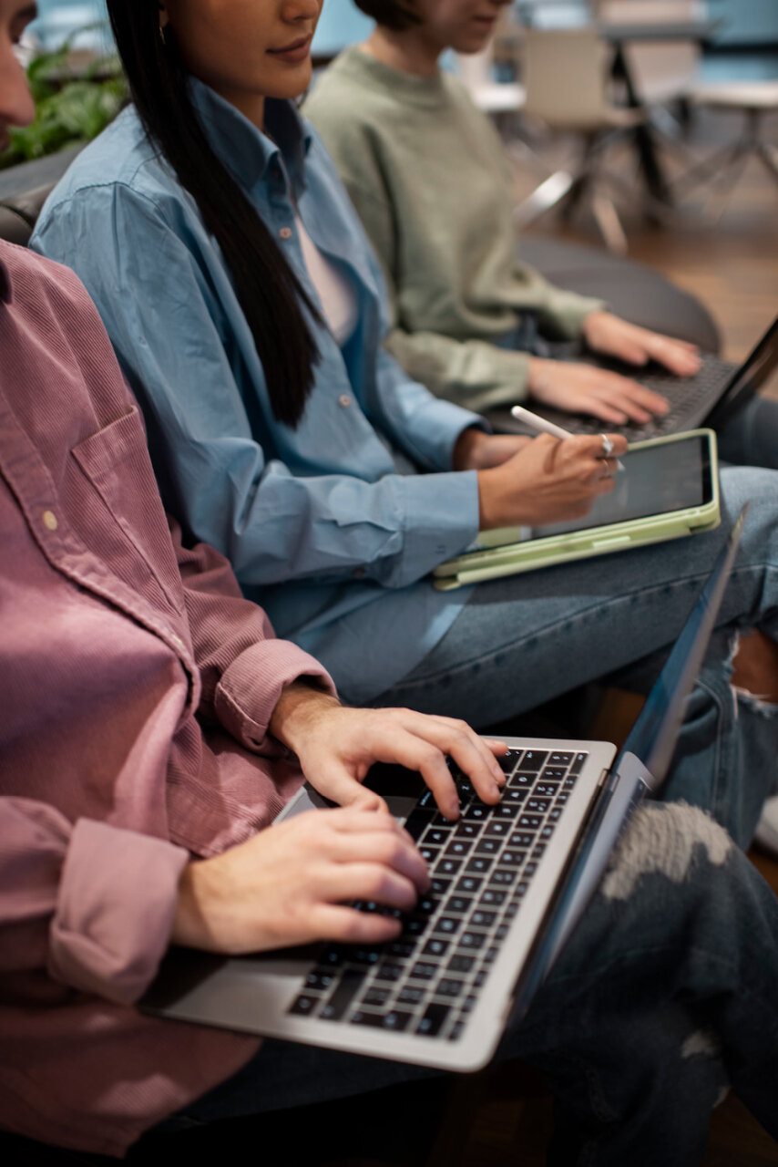 People taking notes on various devices